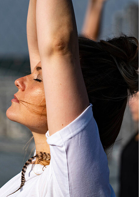 Employee in the middle of a breathing or yoga session, illustrating well-being initiatives in the company