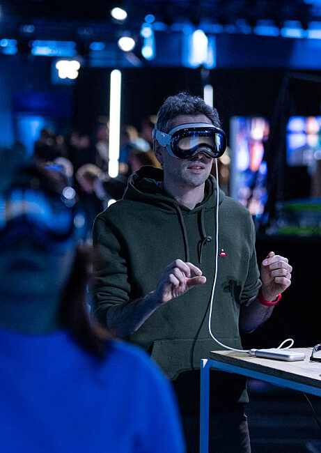 Participant equipped with a virtual reality headset during an immersive activation