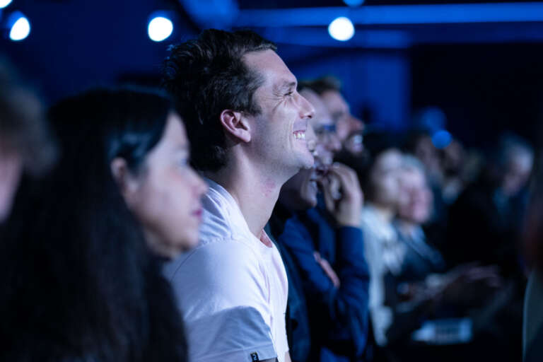 Engaged audience at a professional event, showcasing the power of immersive staging